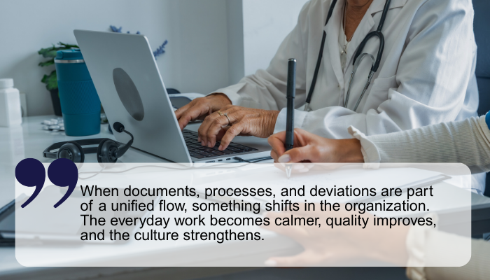 Two people working by a desk