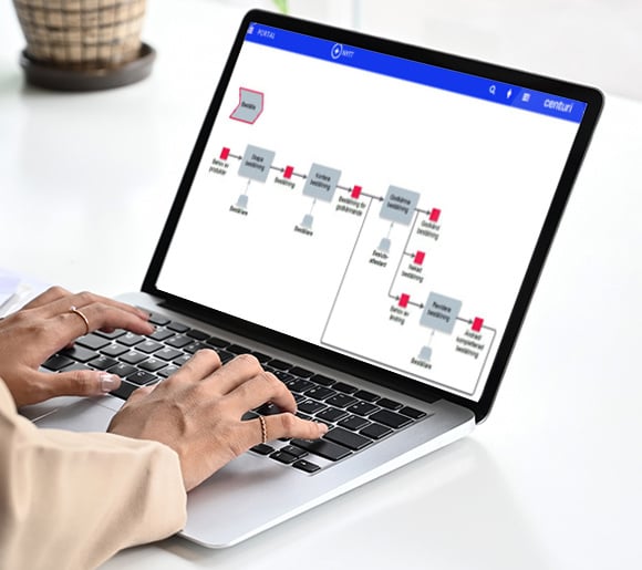 picture of a woman writing on a keyboard watching a process