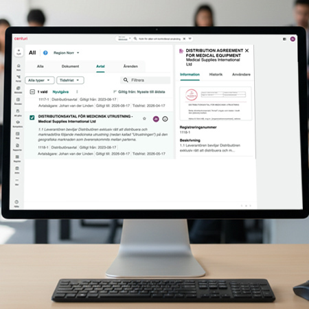 image of a computer with contract management in a QMS